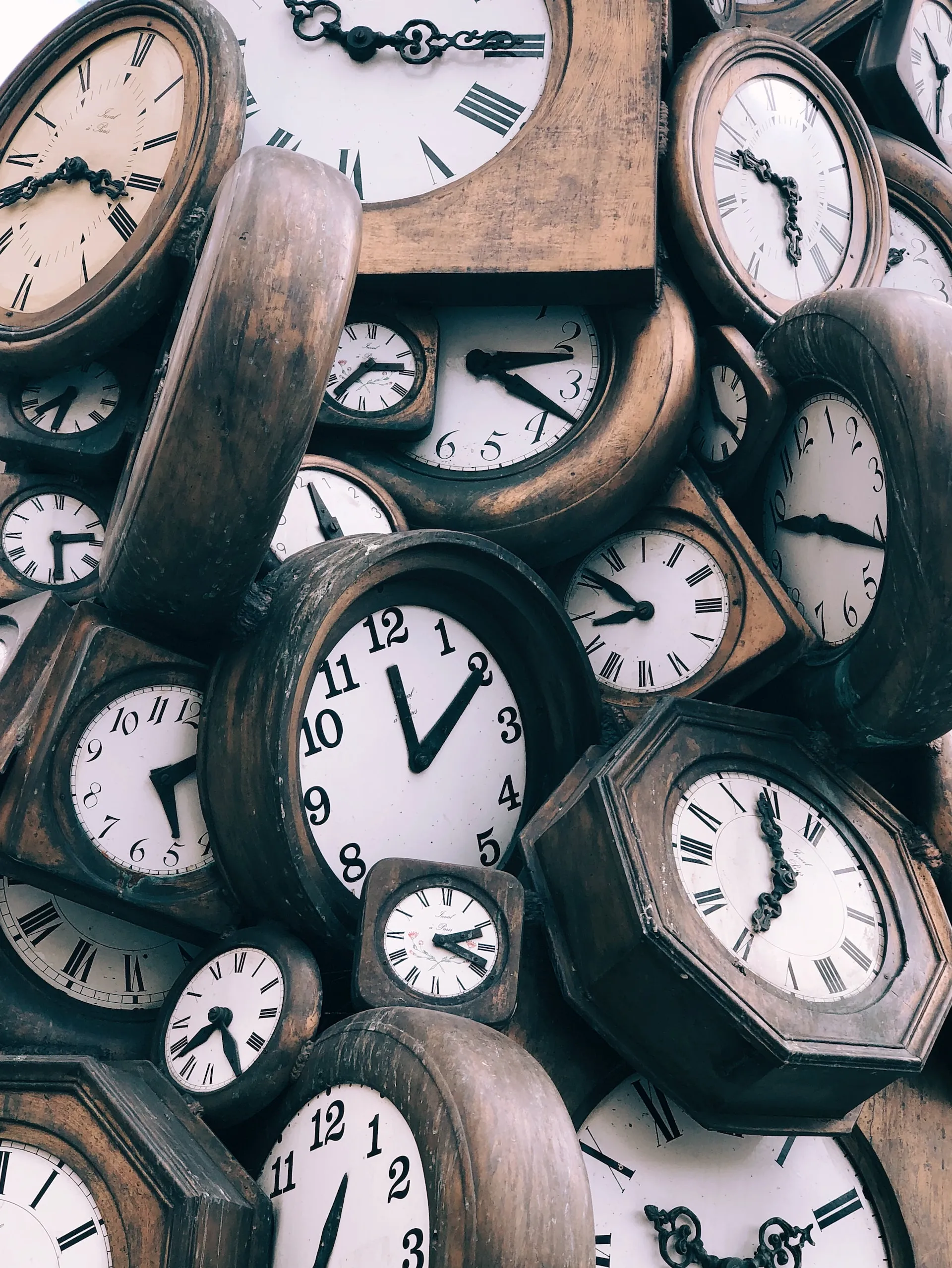 A pile of old clocks