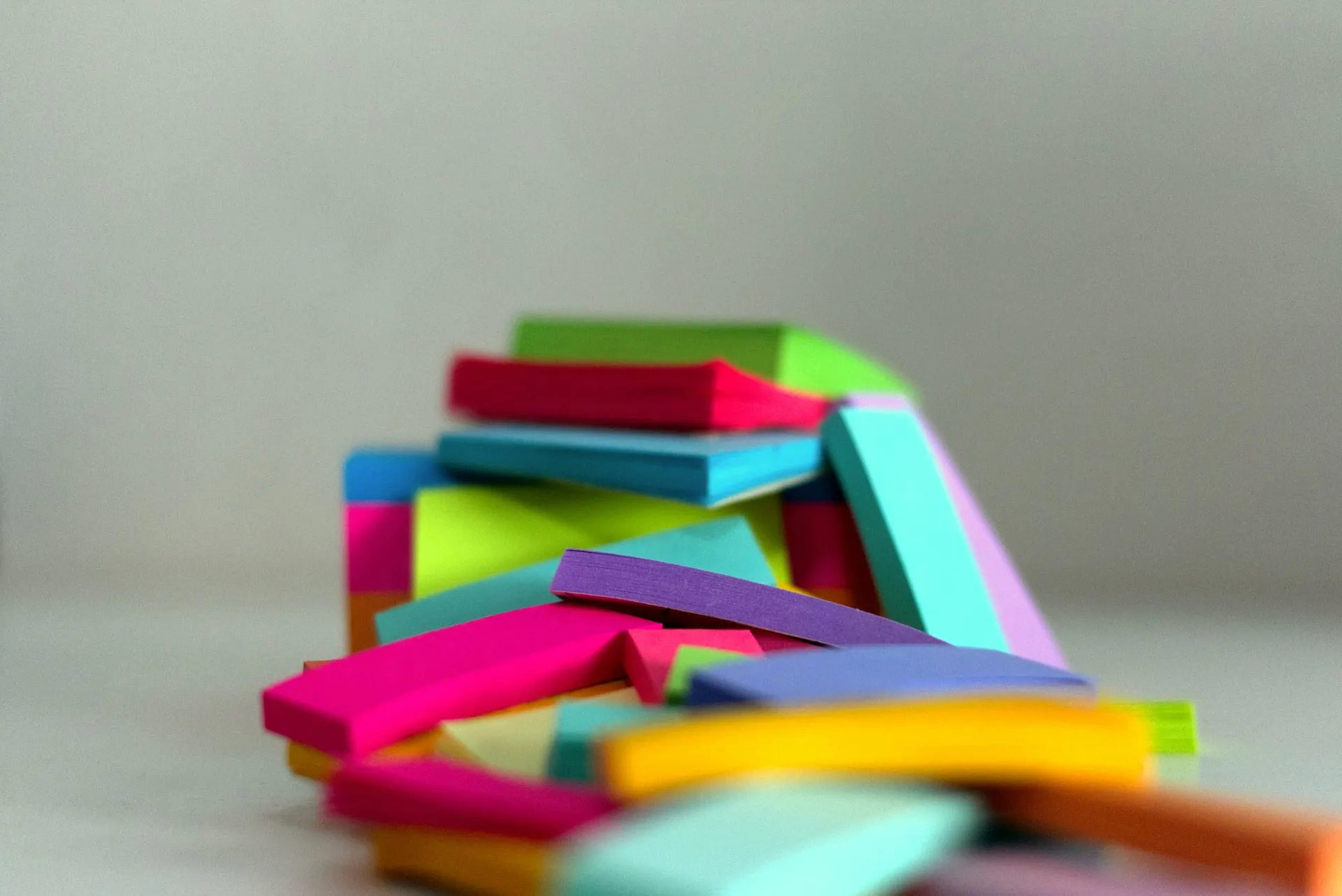 An stack of open books with bookmarks