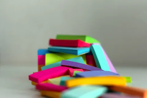 An stack of open books with bookmarks