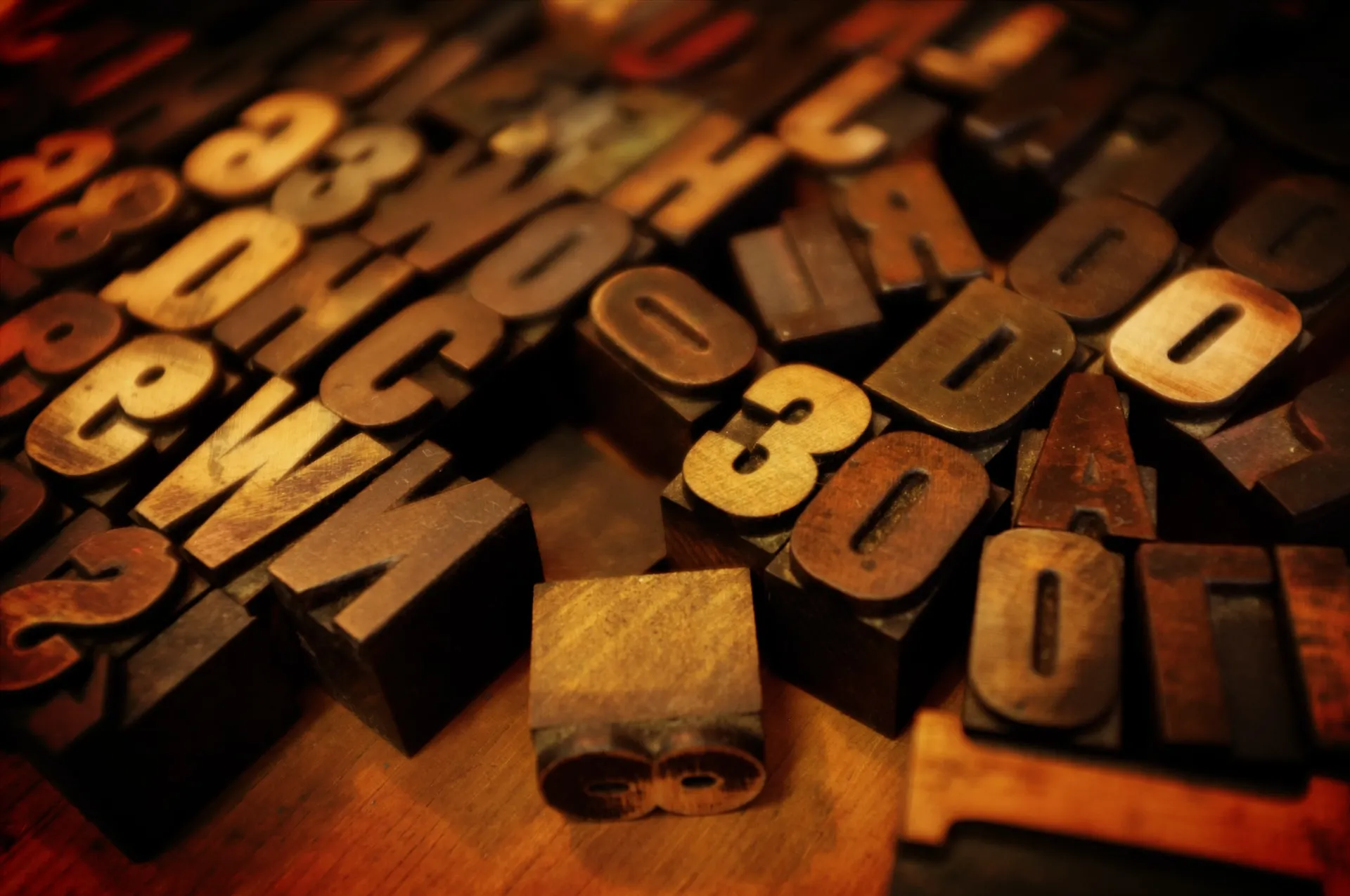 A tilt-shift perspective of random, old wood type characters