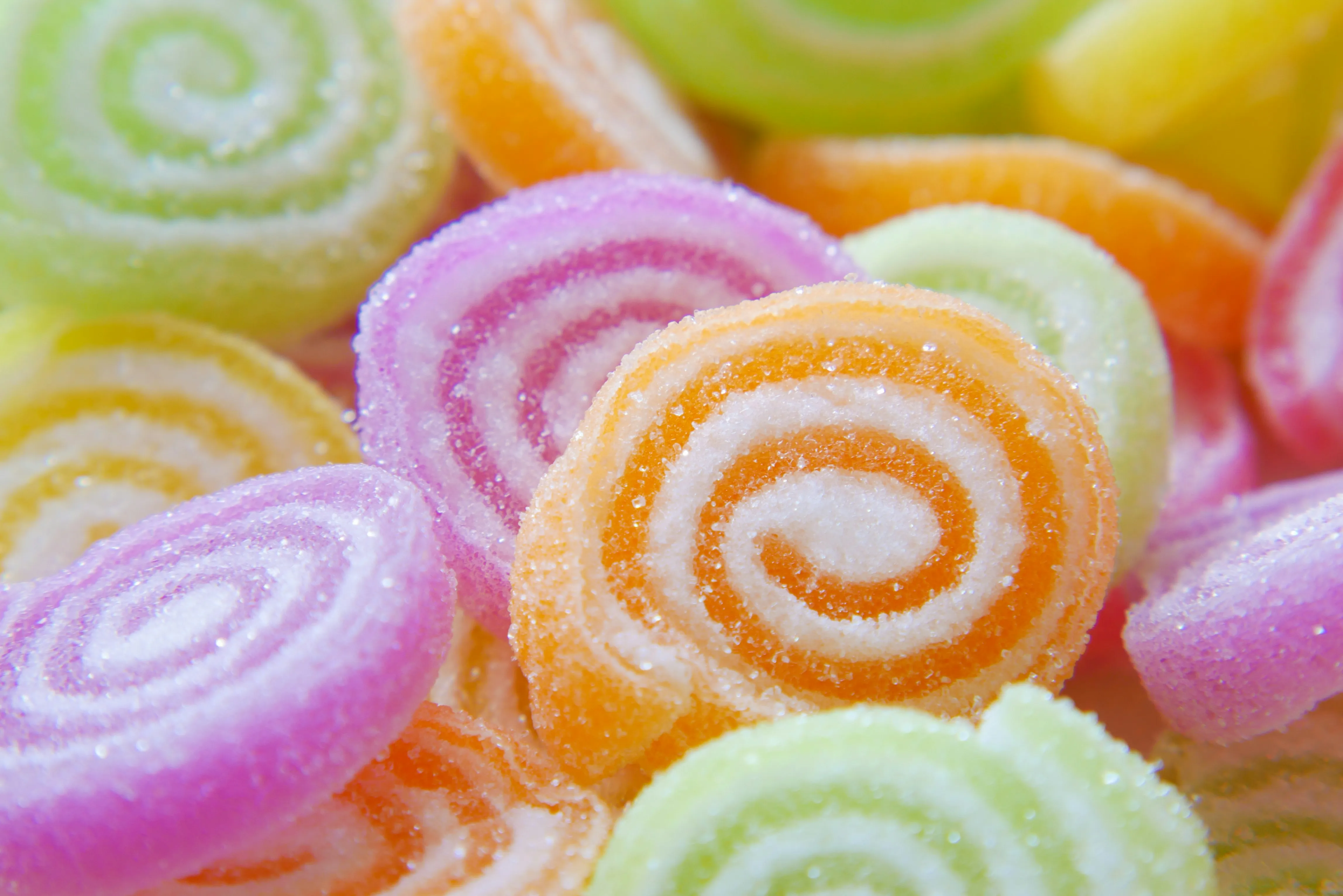A close up of a pile of colorful candies